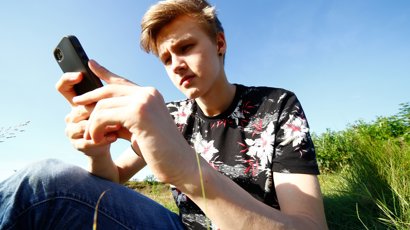 9398925-teenager-with-smartphone.jpg